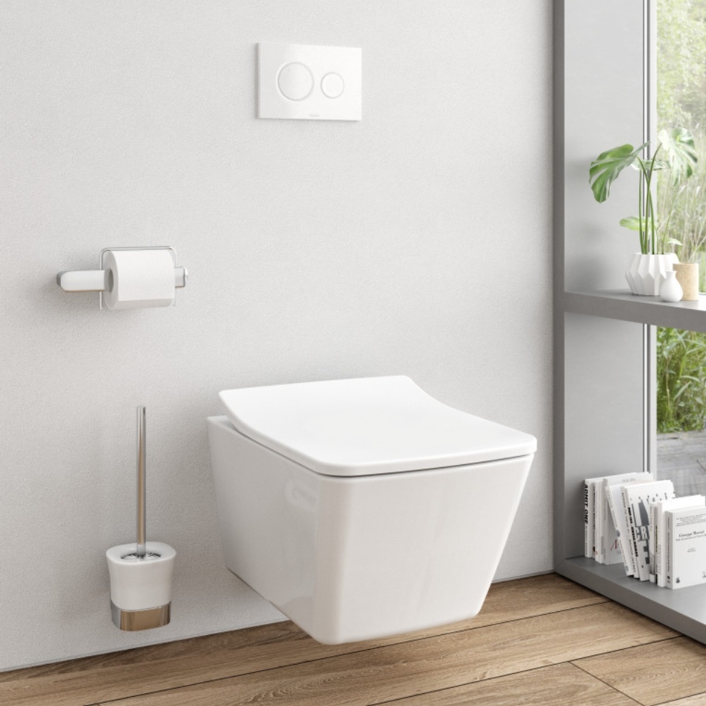 Lifestyle image of the TOTO SP Wall Hung Rimless Toilet mounted on a white bathroom wall